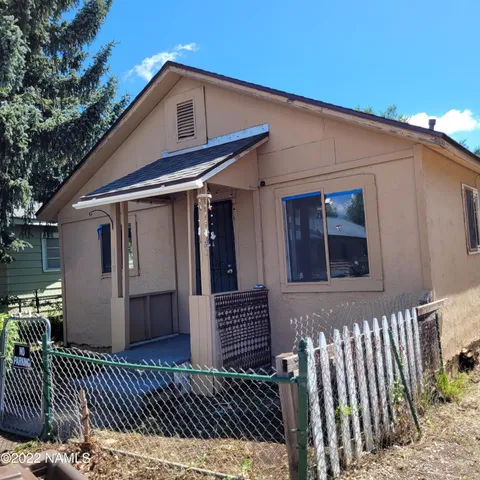 a front view of a house with a fence