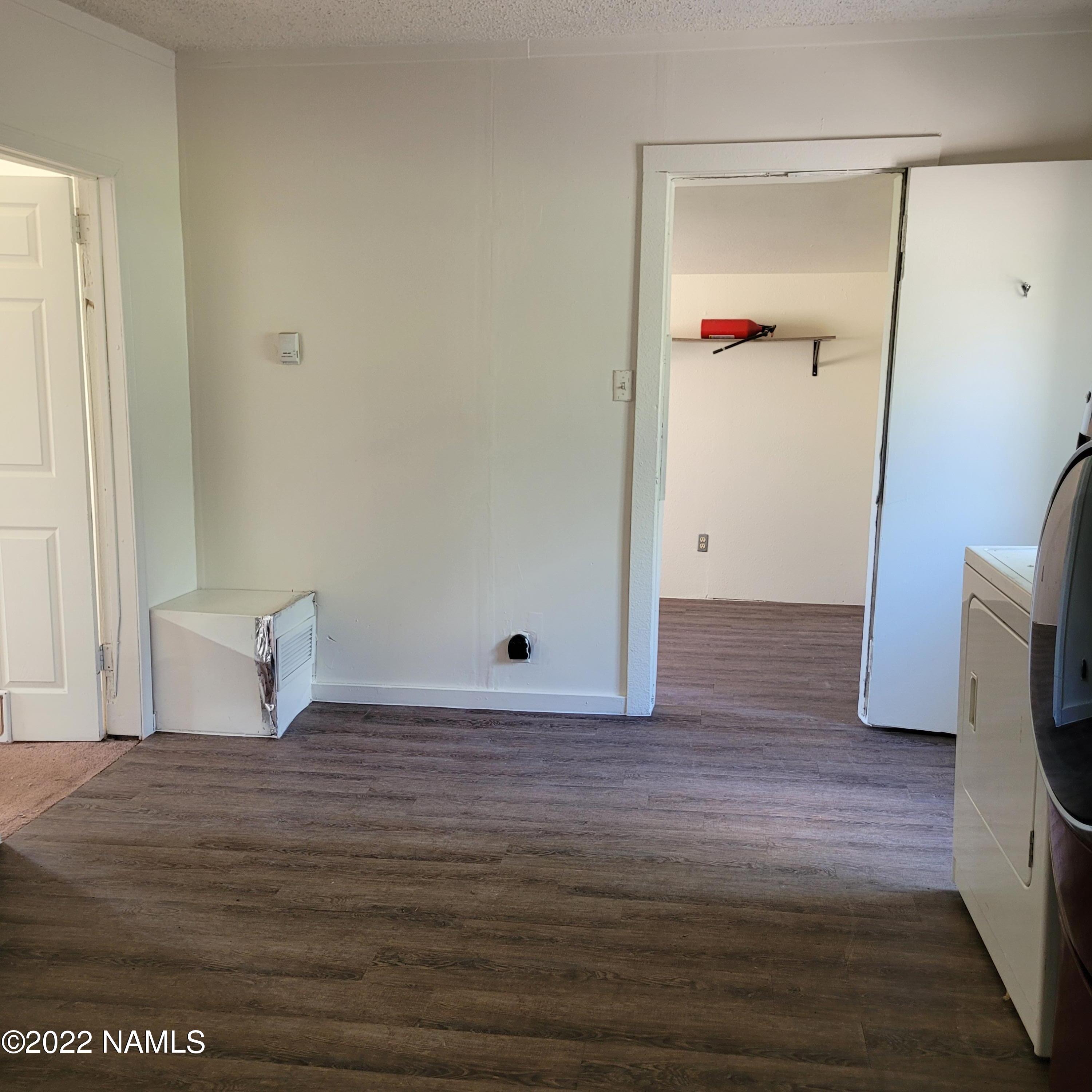 418 South WC Riles Drive Flagstaff, AZ 86001 - Photo 4 of 11 a view of a room with wooden floor and lounge chair