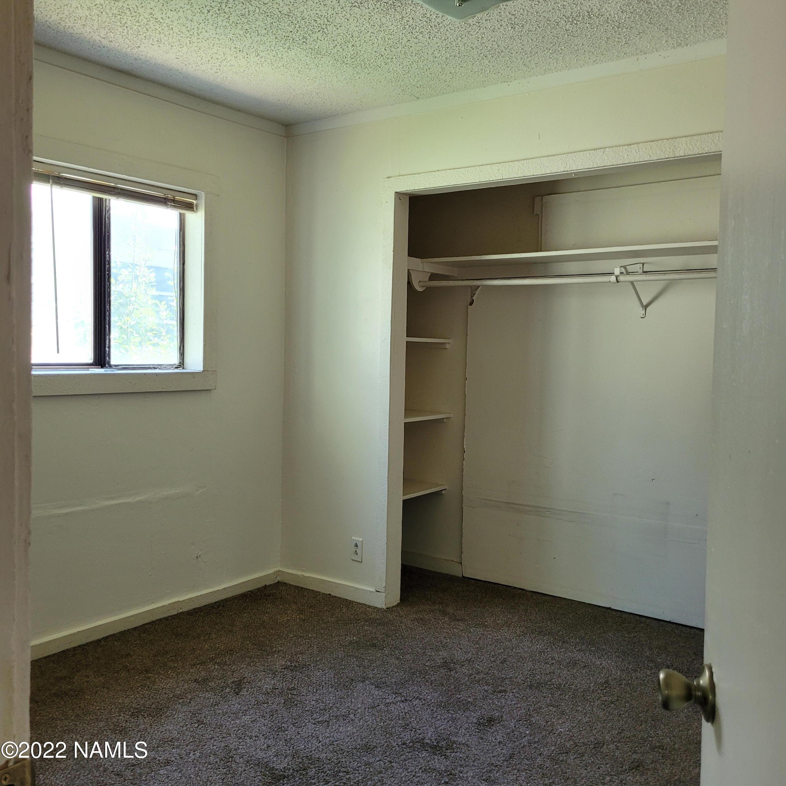 418 South WC Riles Drive Flagstaff, AZ 86001 - Photo 7 of 11 a view of an empty room with a window