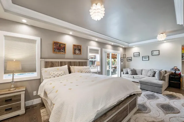a view of a patio with a table and chairs under an umbrella
