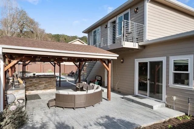 a kitchen with stainless steel appliances a refrigerator stove microwave and sink