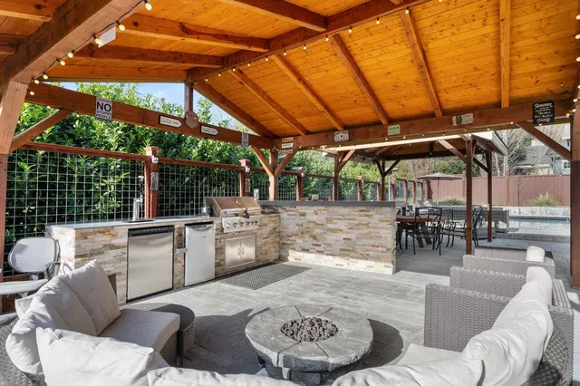a dining table seating space with a large window