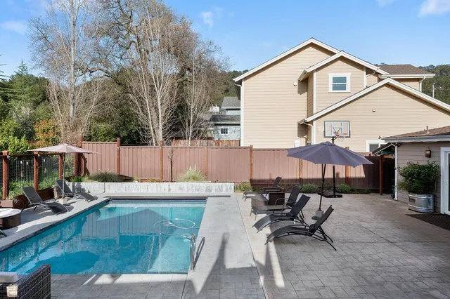 a view of a chairs and table in a patio