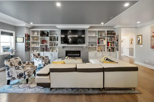 a living room with furniture and kitchen view