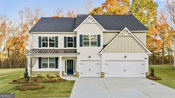 a view of house with yard in front of it