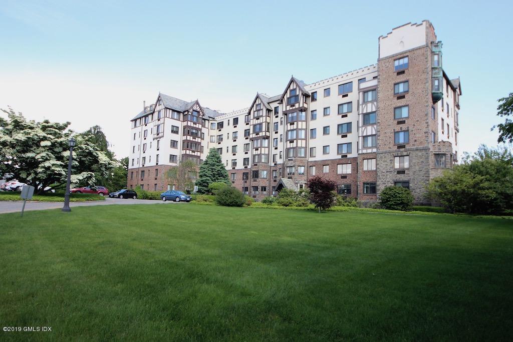 a large building with a yard in front of it
