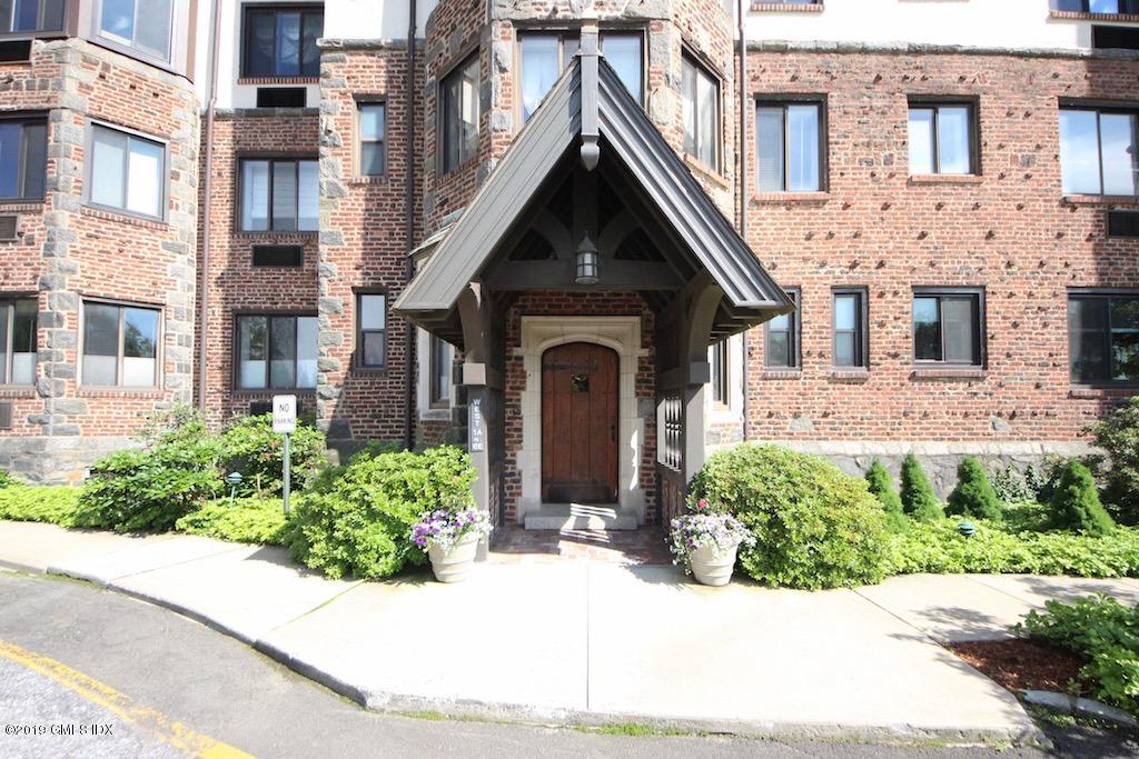 47 Lafayette Place, Unit 5D Greenwich, CT 06830 - Photo 8 of 8 a front view of a house with yard