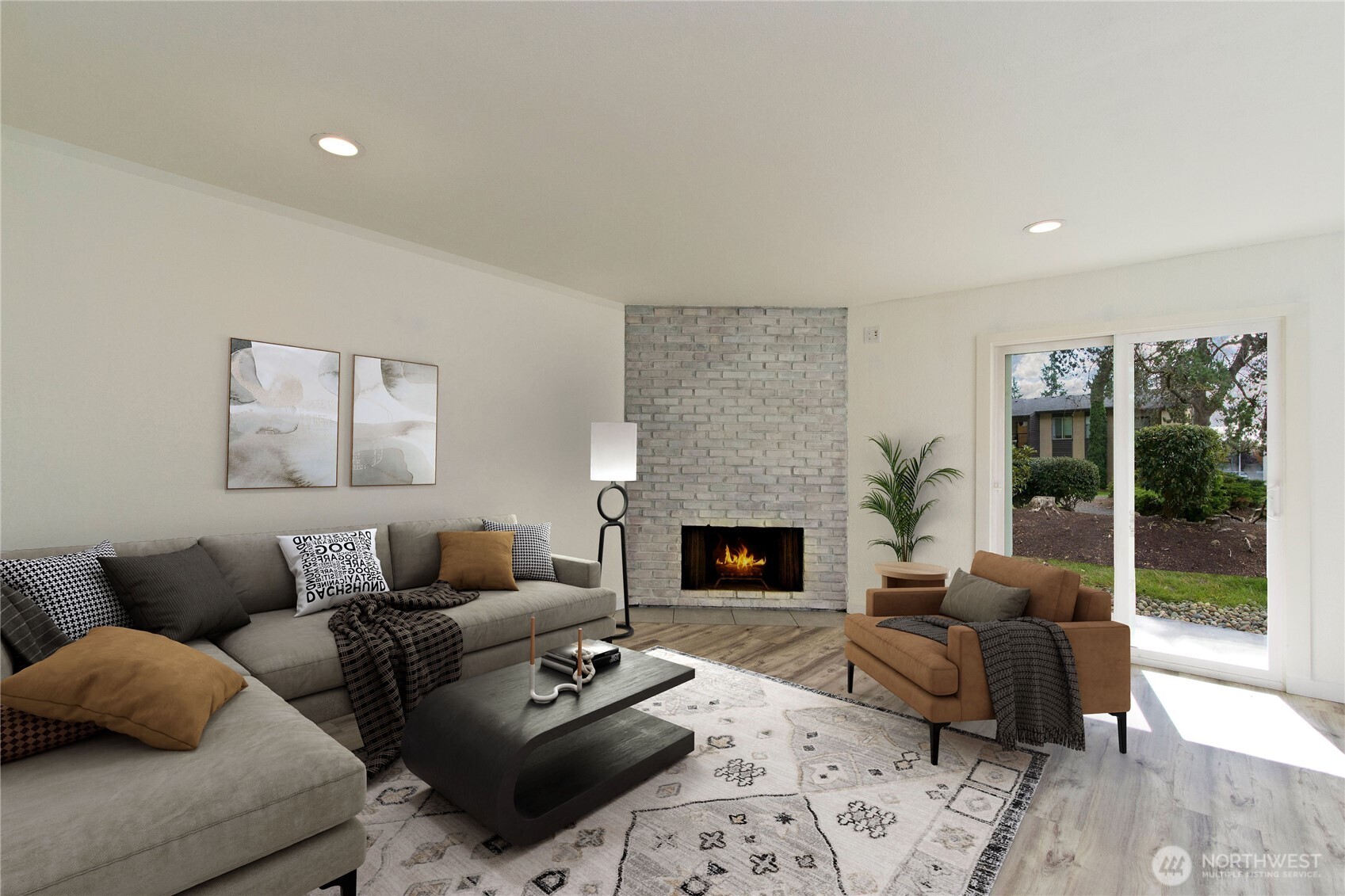 12515 Northeast 145th Place, Unit D127 Kirkland, WA 98034 - Photo 1 of 21 a living room with furniture and a fireplace