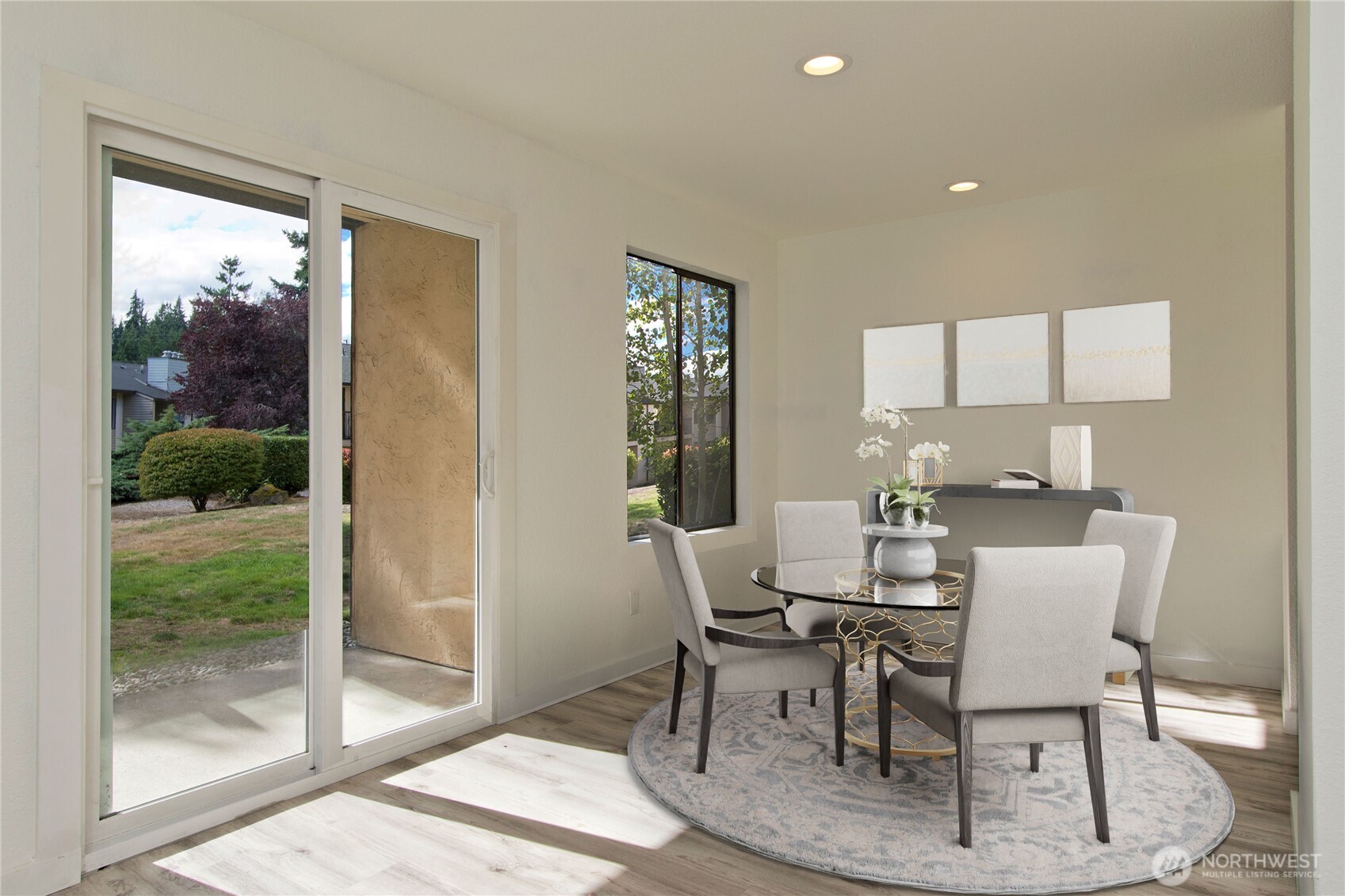 12515 Northeast 145th Place, Unit D127 Kirkland, WA 98034 - Photo 7 of 21 a dining room with furniture and wooden floor