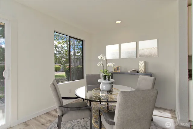 a view of a dining room with furniture window and outside view