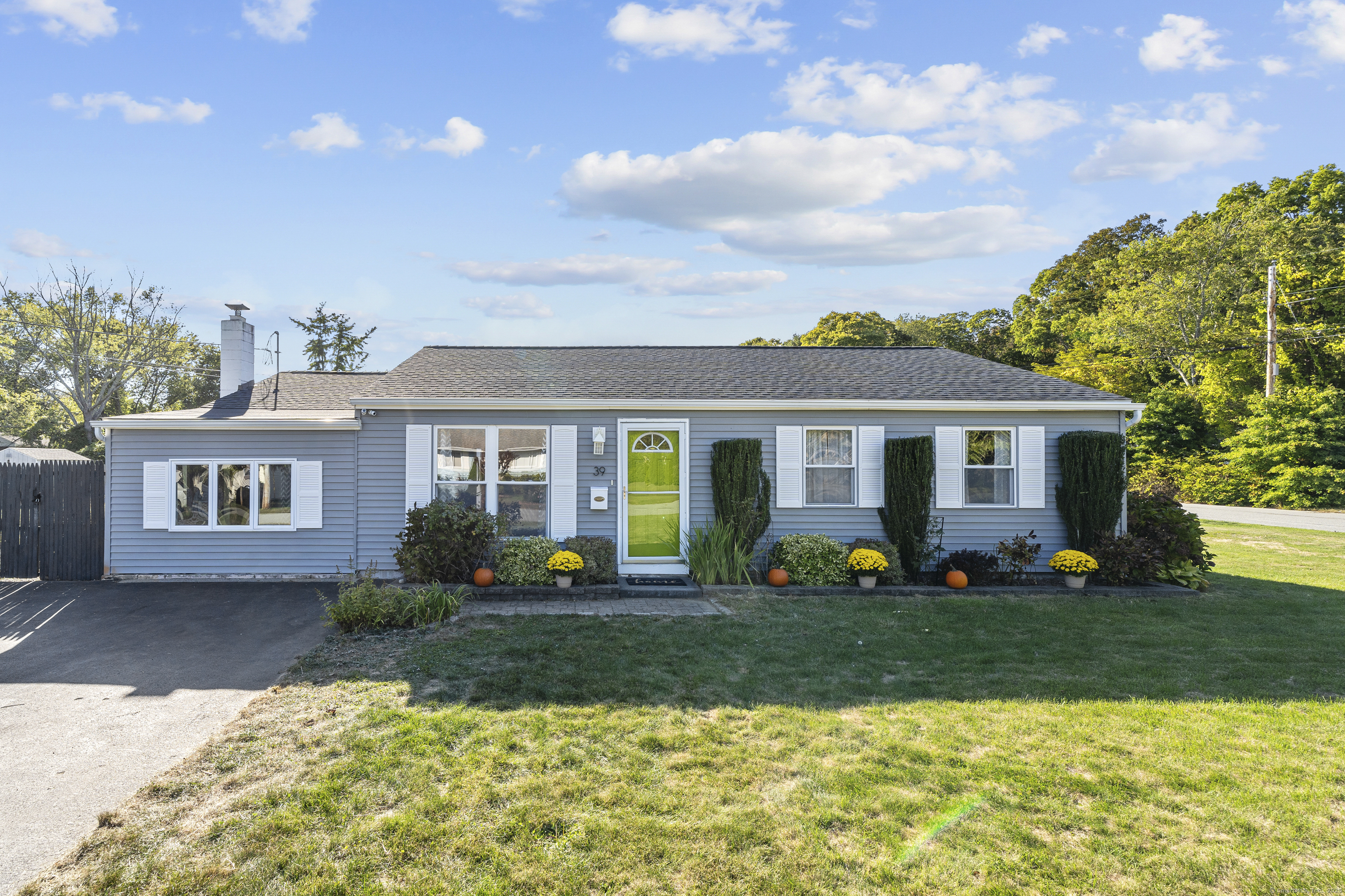 39 Meryl Court Groton, CT 06340 - Photo 1 of 1 a front view of a house with garden and porch