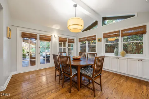 a view of a dining room with furniture window and wooden floor