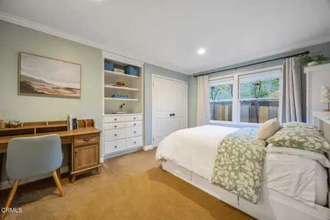 a spacious bedroom with a bed and furniture