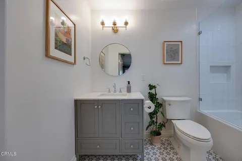 a bed room with a bed and a chair