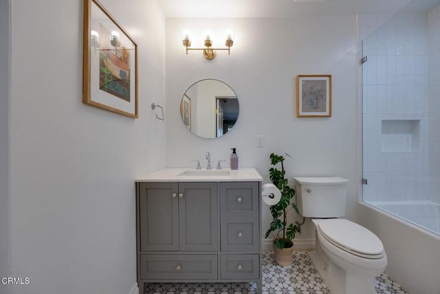 a bed room with a bed and a chair