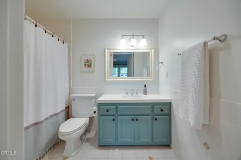 a spacious bedroom with a bed and a couch