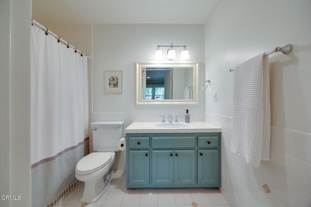 a spacious bedroom with a bed and a couch