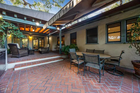 a view of a house with a yard porch and sitting area