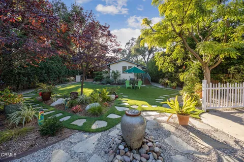 a view of a park with large trees