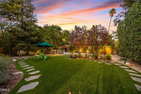 a view of a fountain with a yard