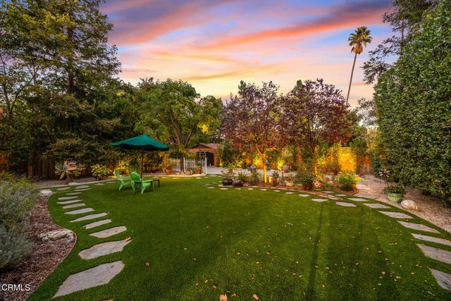 a view of a fountain with a yard