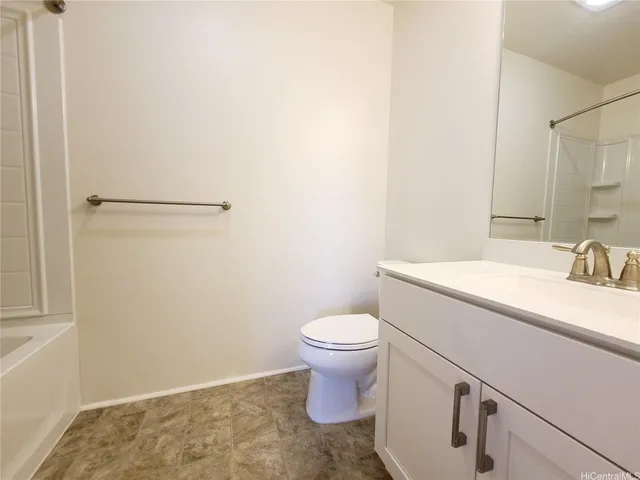 an empty room with a empty space and windows