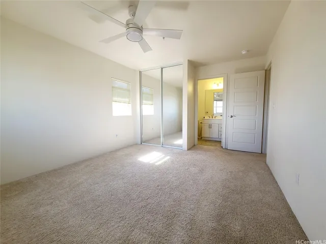 an empty room with a empty space and windows