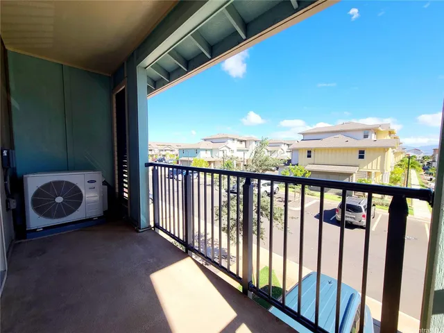 a view of a balcony with wooden floor