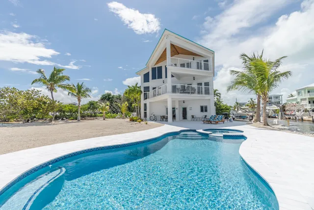 a view of outdoor space with swimming pool and furniture