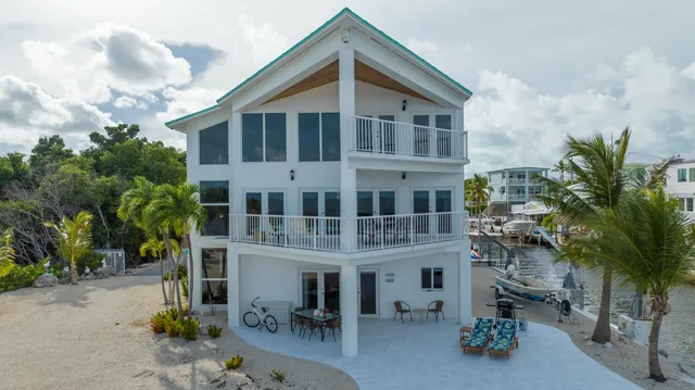 a stove top oven sitting inside of a kitchen