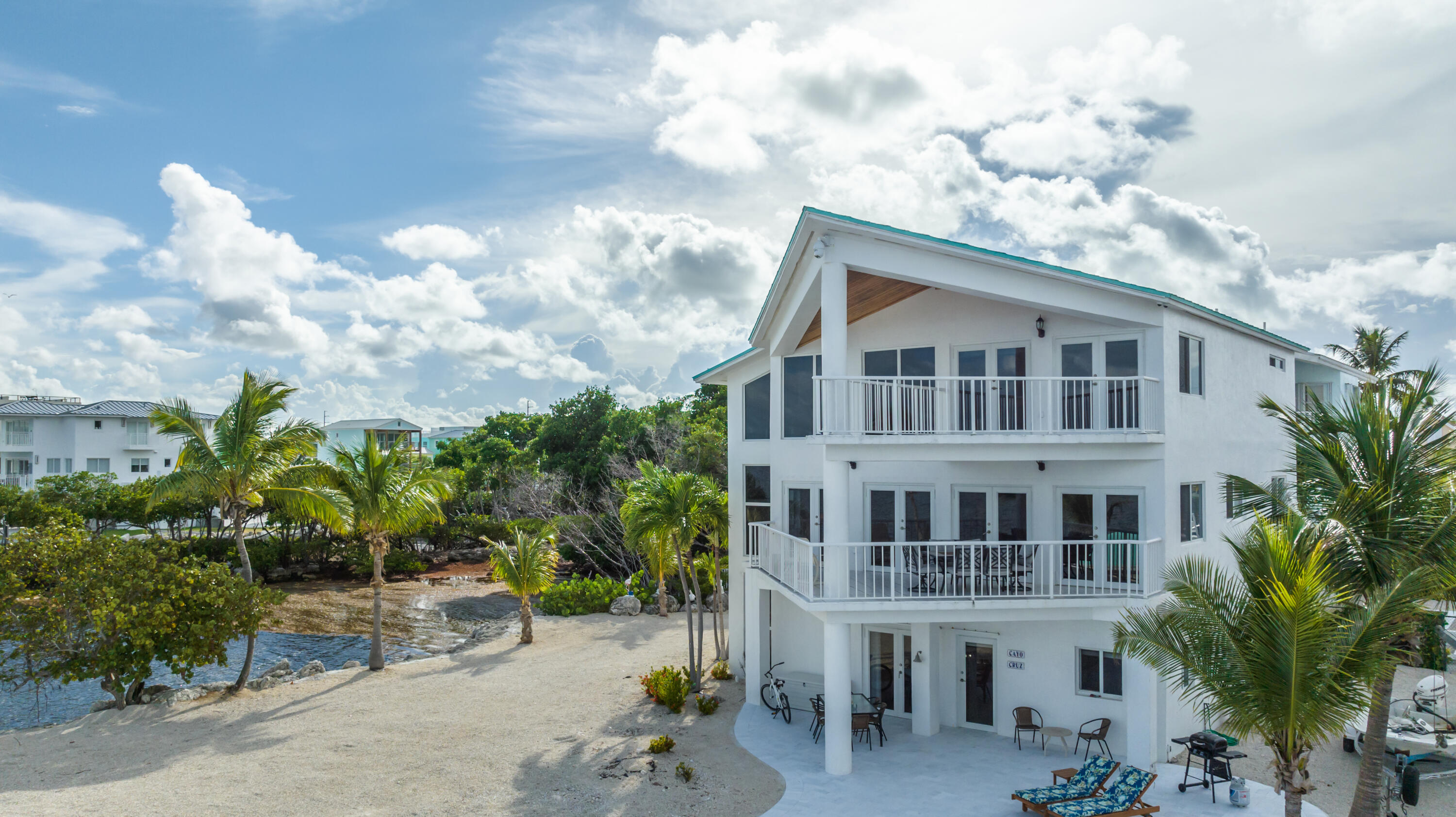 601 Cuda Lane Key Largo, FL 33037 - Photo 36 of 90 a front view of a house with garden