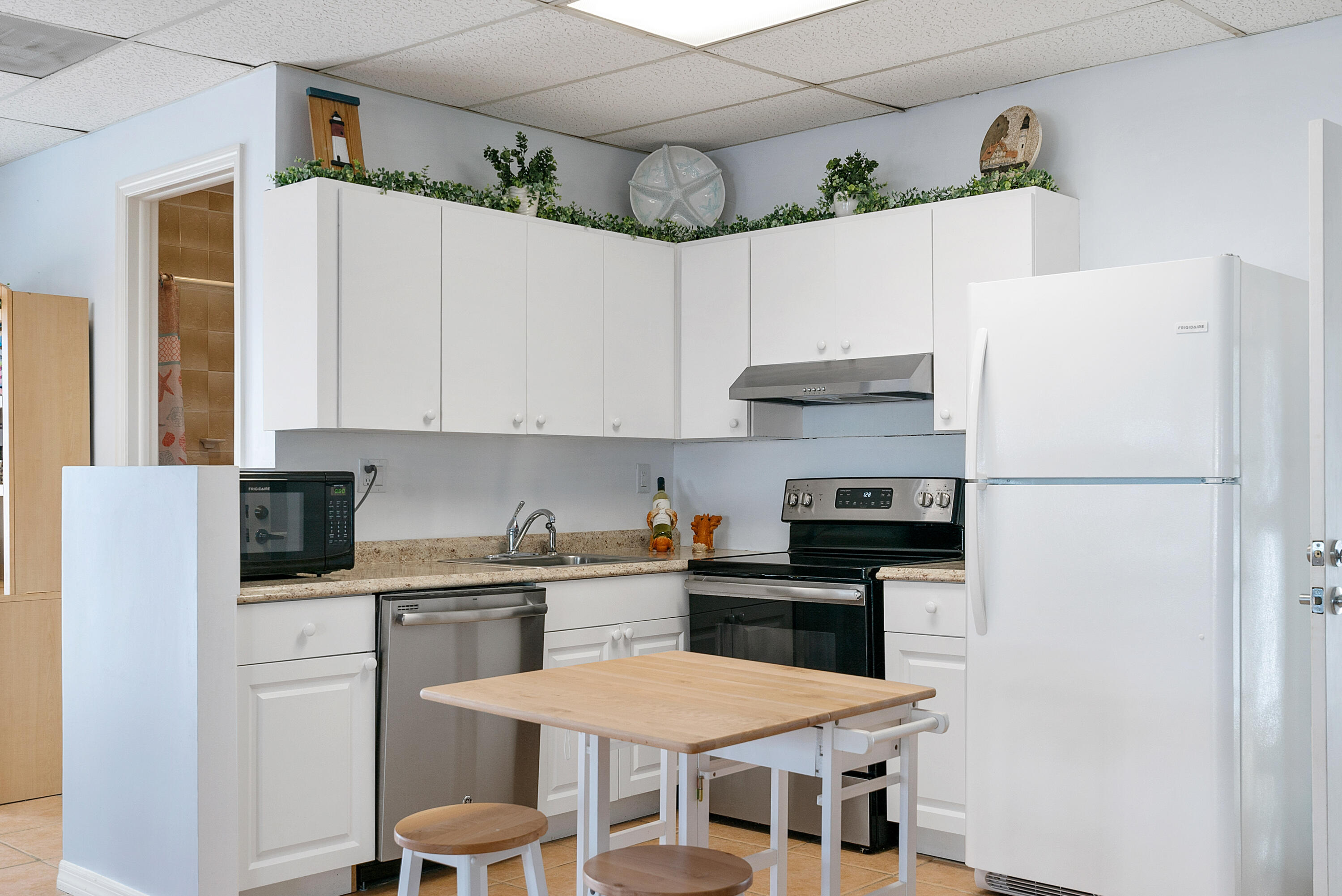 601 Cuda Lane Key Largo, FL 33037 - Photo 53 of 90 a kitchen with stainless steel appliances a refrigerator and a stove top oven