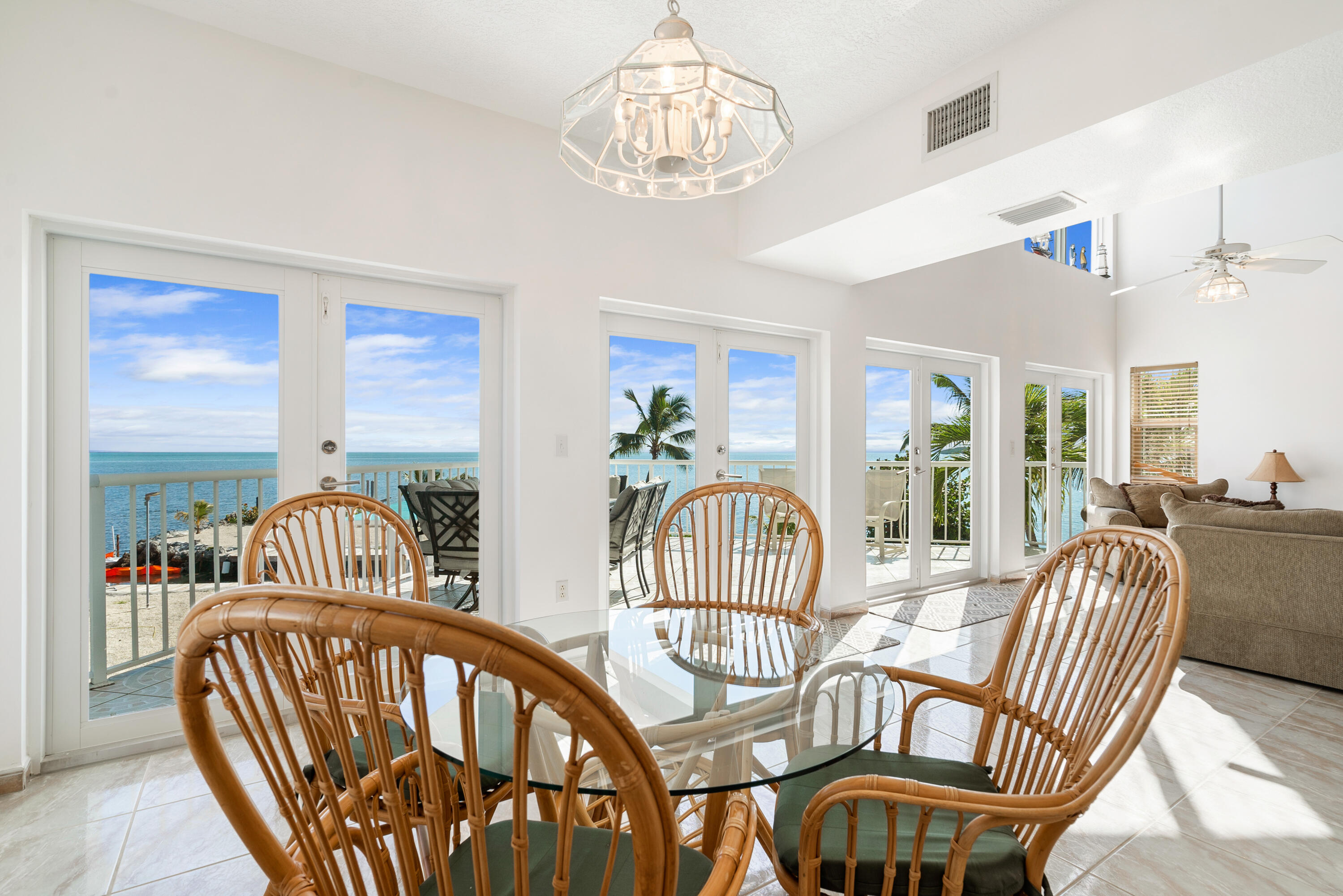 601 Cuda Lane Key Largo, FL 33037 - Photo 62 of 90 a view of a dining room with furniture wooden floor and windows