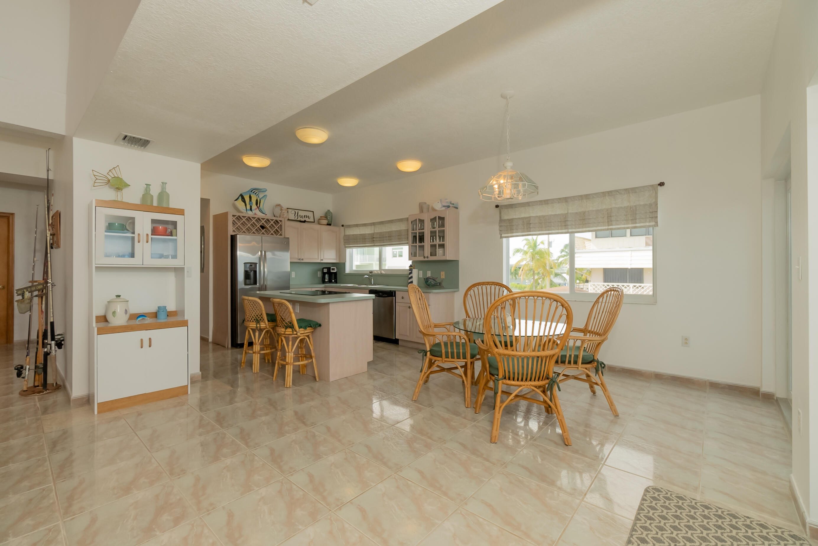 601 Cuda Lane Key Largo, FL 33037 - Photo 63 of 90 a dining room with furniture and a kitchen view