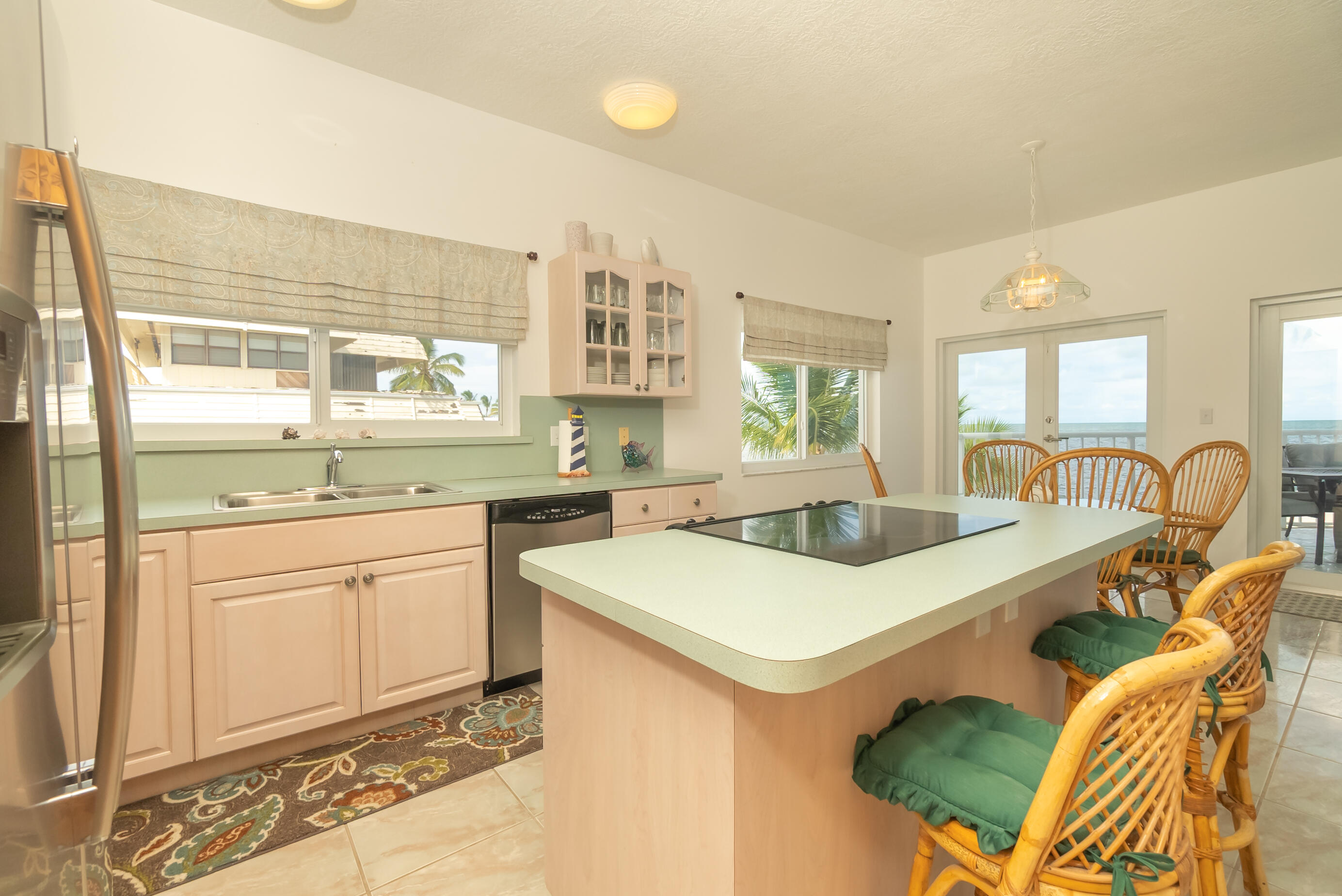 601 Cuda Lane Key Largo, FL 33037 - Photo 67 of 90 a kitchen with stainless steel appliances granite countertop a sink and a stove top oven