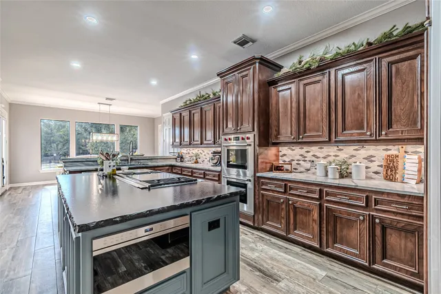 a kitchen with a stove and a sink
