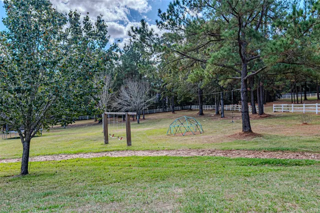 a view of a pathway of a house with a yard