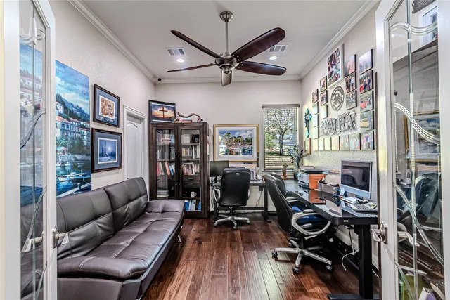 a large white kitchen with a lot of counter space and a sink