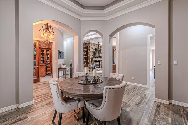 a view of a dining room with furniture and wooden floor