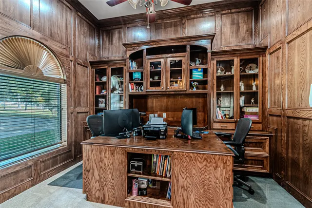 a view of an outdoor kitchen with seating space