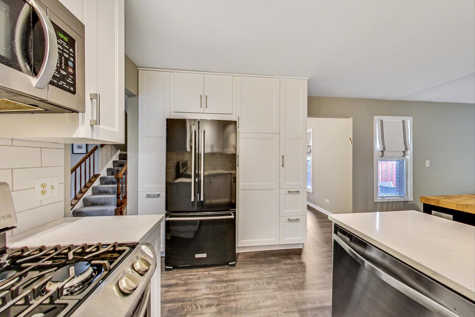 9024 Forestview Road Evanston, IL 60203 - Photo 11 of 41 a kitchen with a stove and a refrigerator