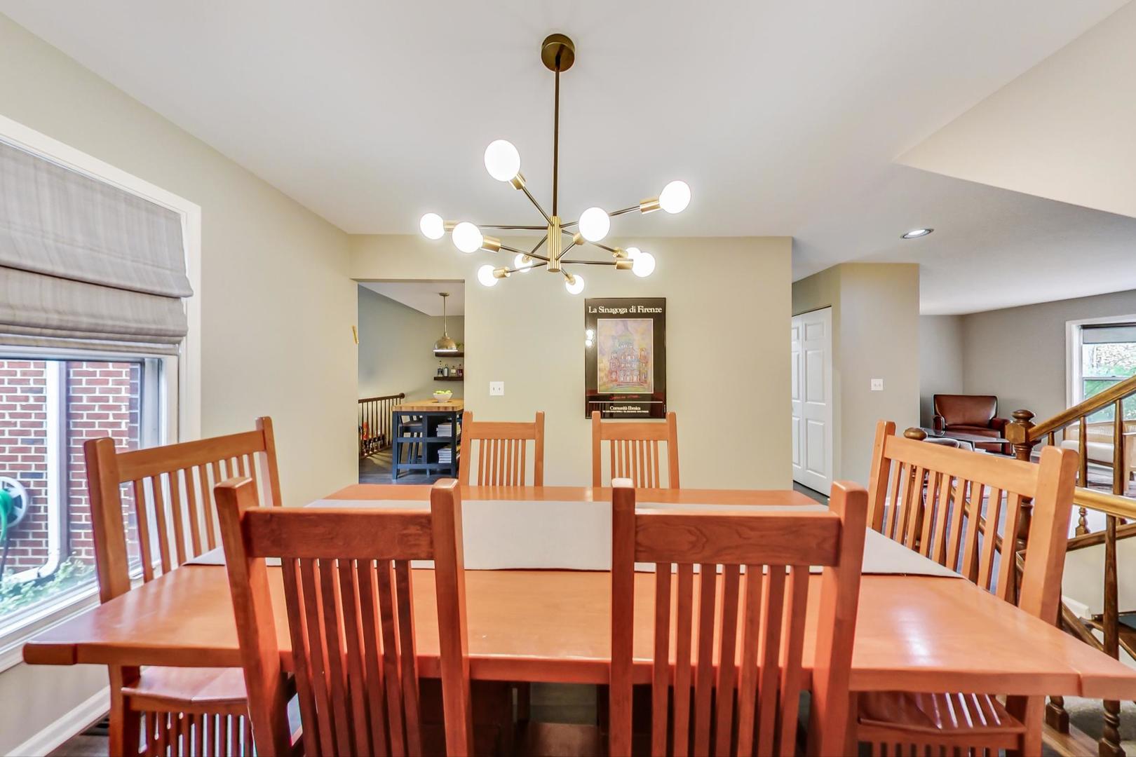 9024 Forestview Road Evanston, IL 60203 - Photo 12 of 41 a view of a dining room with furniture and wooden floor
