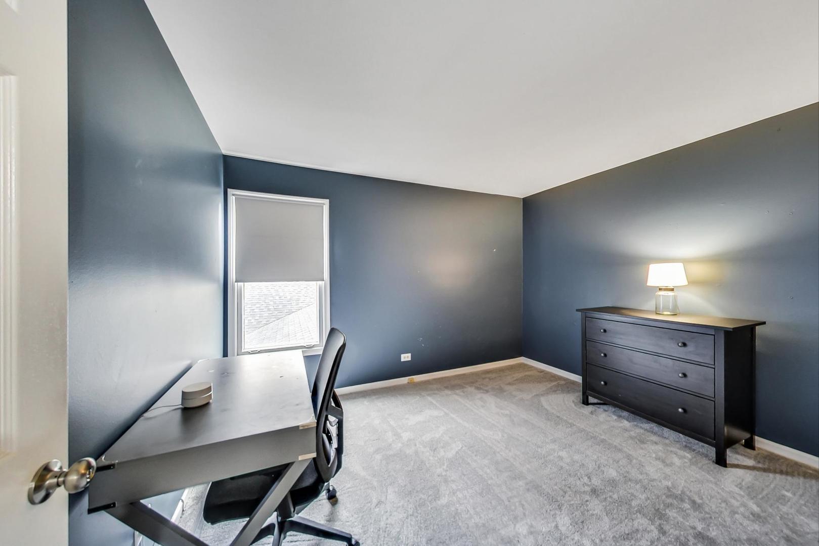 9024 Forestview Road Evanston, IL 60203 - Photo 24 of 41 a workspace with furniture and window