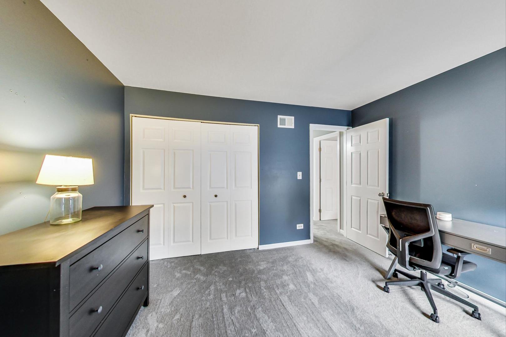 9024 Forestview Road Evanston, IL 60203 - Photo 25 of 41 a view of a workspace with furniture and a window