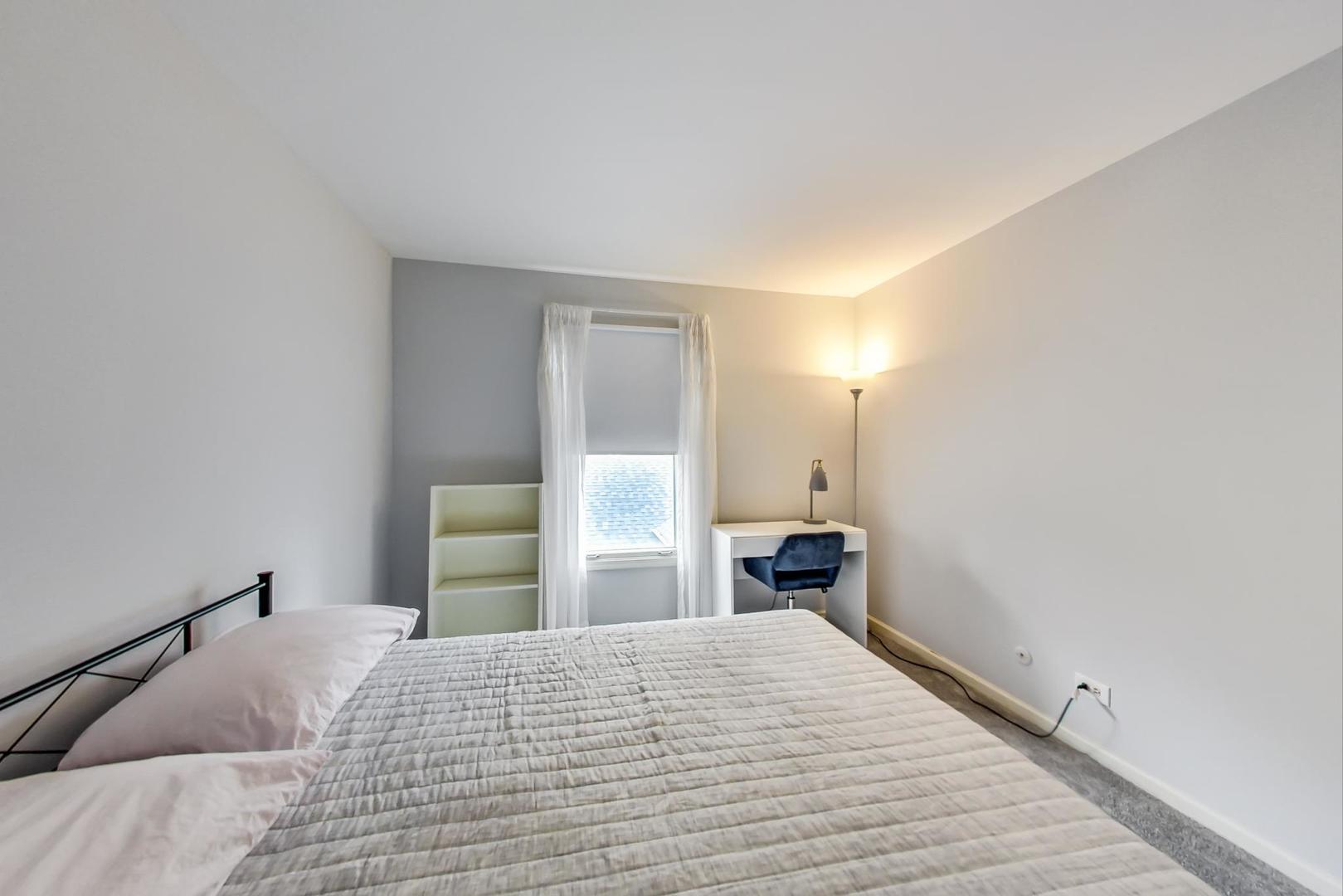 9024 Forestview Road Evanston, IL 60203 - Photo 27 of 41 a bedroom with a bed and a mirror