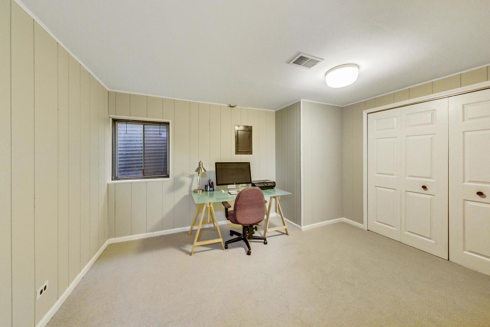 9024 Forestview Road Evanston, IL 60203 - Photo 29 of 41 a workspace with furniture and a window