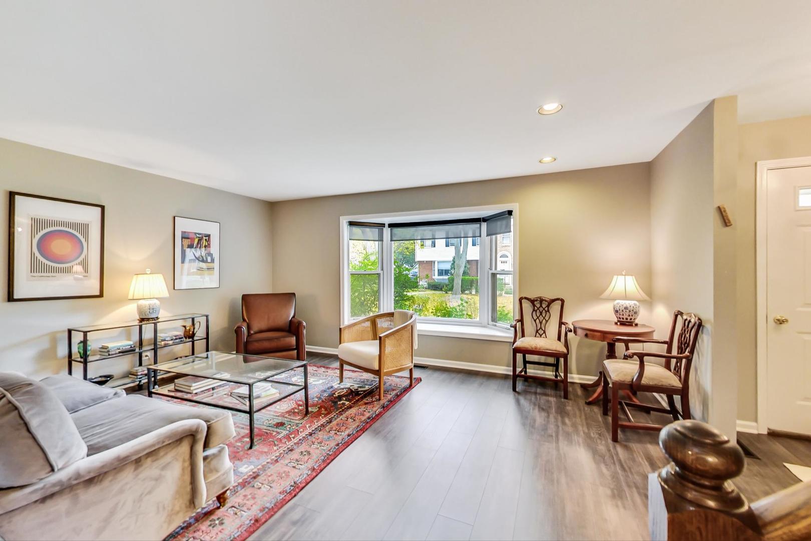 9024 Forestview Road Evanston, IL 60203 - Photo 3 of 41 a living room with furniture and wooden floor