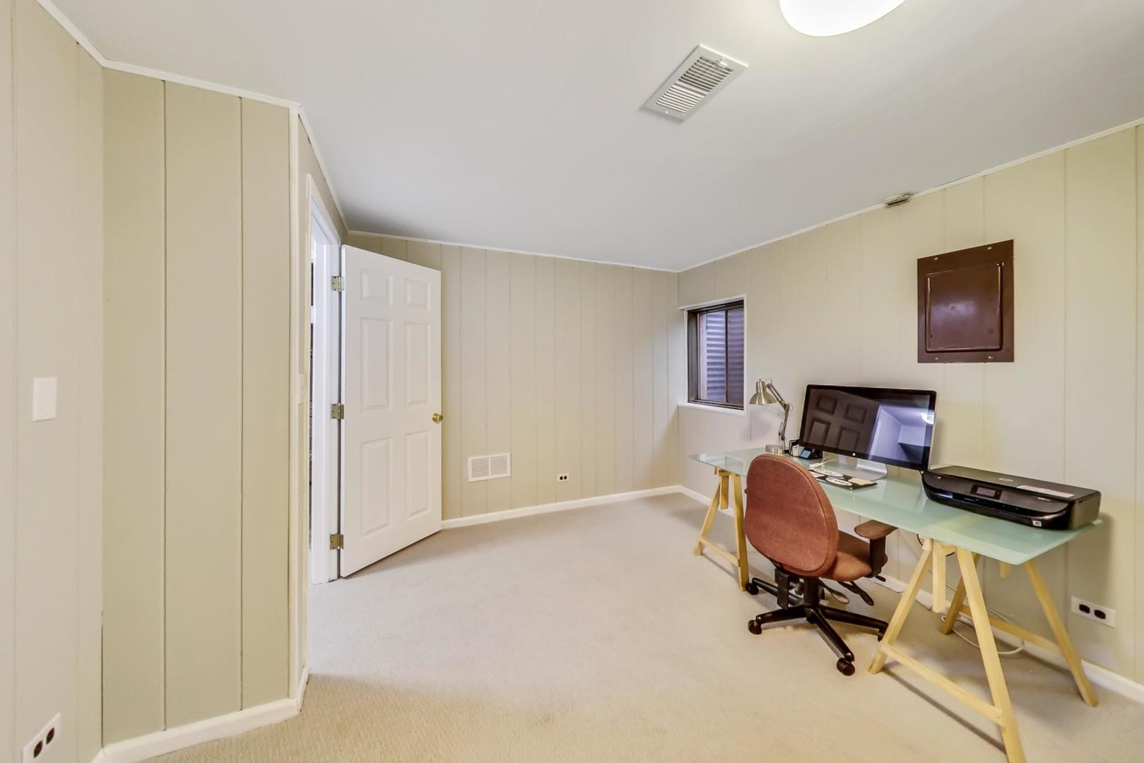 9024 Forestview Road Evanston, IL 60203 - Photo 31 of 41 a view of a workspace with furniture and a window