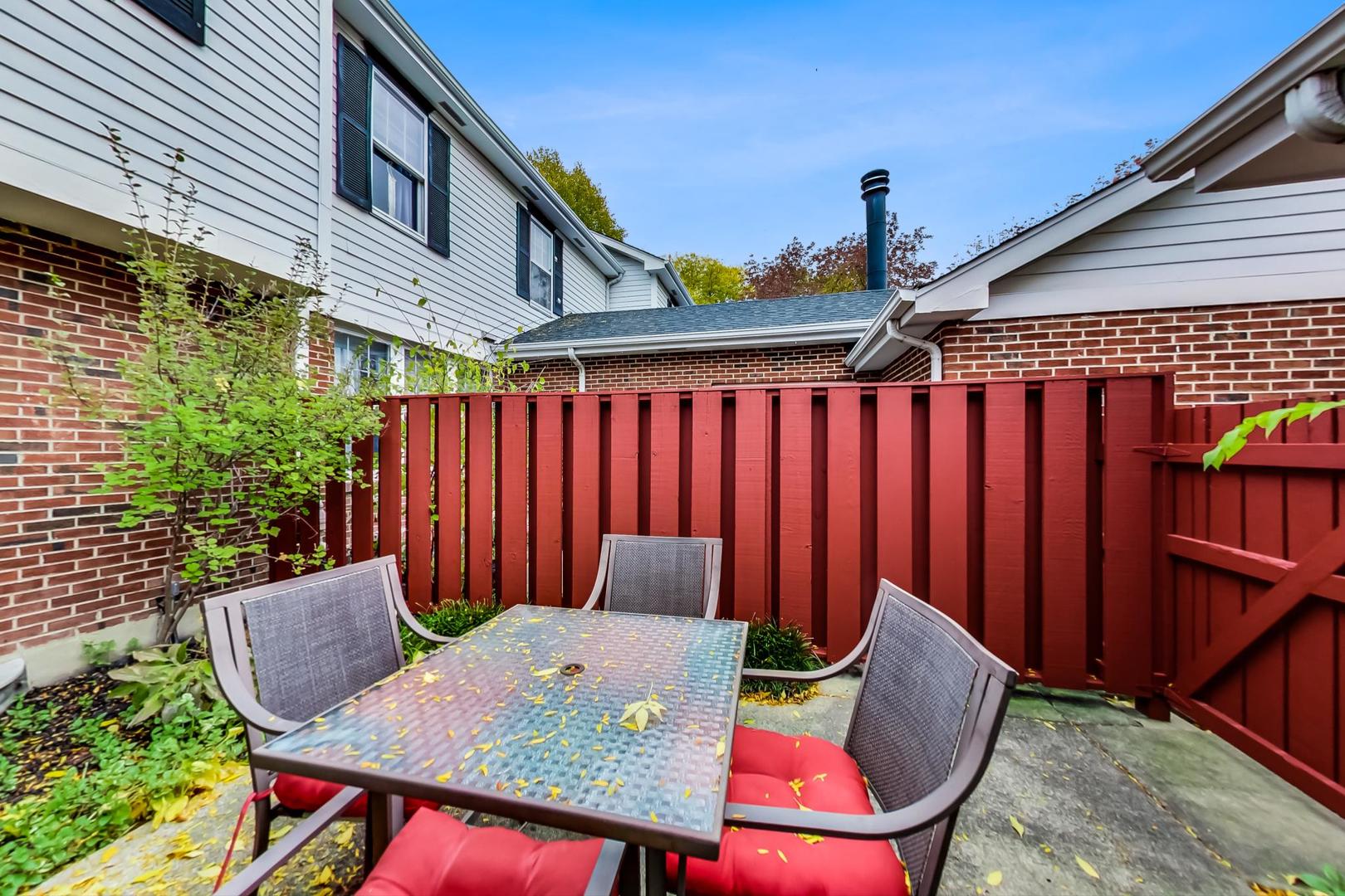 9024 Forestview Road Evanston, IL 60203 - Photo 34 of 41 a backyard of a house with table and chairs