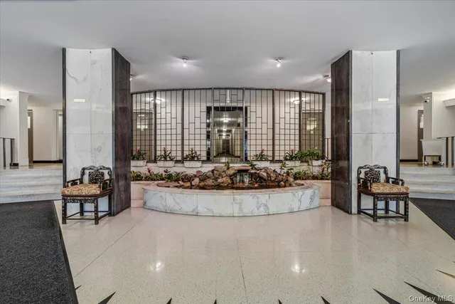 a large living room with furniture and a large window